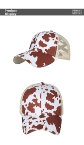 Close-up of cow print pattern and breathable mesh back on this stylish baseball cap