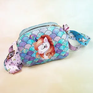 Detail of unicorn crossbody bag showing mermaid scale pattern and printed shoulder strap