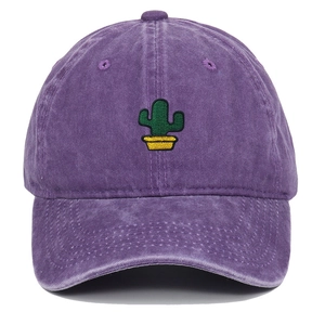 Detailed view of the cactus embroidery on a vintage washed purple cotton baseball cap