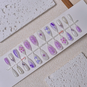 3D purple flower press-on nails with almond shape, gradient finish and pearl accents