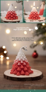 Close-up of red and white Christmas tree candle with tiered needle textures and cotton wick