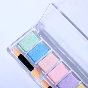 Macro detail of 6-color solid mirror powder palette with dual-ended sponge applicators