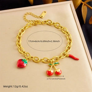 Gold stainless steel chain bracelet featuring red strawberry, cherry, and chili enamel charms