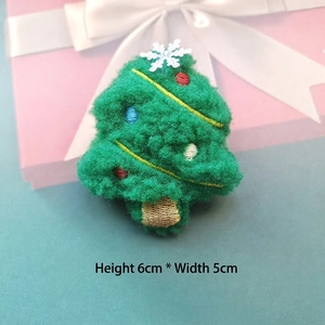 Detail of green plush Christmas tree brooch with colorful embroidery, size 6cm by 5cm