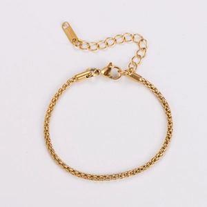 Detail of golden stainless steel square chain bracelet with lobster clasp and extension