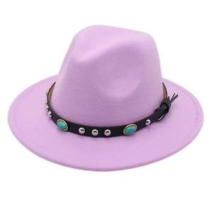 Detail of lavender fedora hat with black leather band featuring turquoise and silver studs