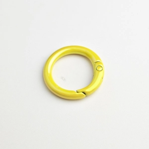 Macro shot of bright yellow spring ring clasp for DIY jewelry and bag accessories