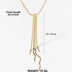 Detail of gold triangle tassel necklace showing 42.5cm snake chain and 19cm drop fringe