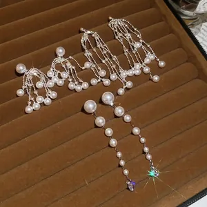 Elegant silver needle pearl tassel earrings with zircon waterdrop details on velvet tray