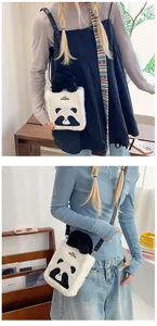 Detailed view of cute plush panda crossbody bag with black handles and shoulder strap
