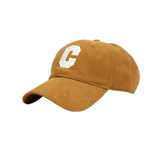 Mustard yellow cotton baseball cap with white C embroidery and curved brim in side view