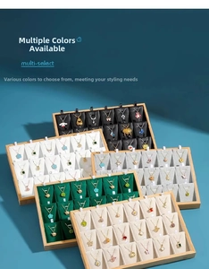 Bamboo wood jewelry display trays featuring multiple slots for necklaces and pendants