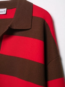 Close-up of brown striped knit polo collar with visible texture and woman size S tag