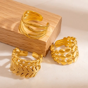 Three-piece set of gold plated titanium steel open rings with leaf and wave textures