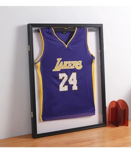 Detail of a black wooden jersey display frame with high-transparency glass panel