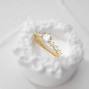 Detailed macro view of S925 hallmark on a luxury gold square silver engagement ring