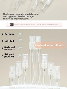 Detailed view of empty glass perfume spray bottles in multiple sizes with fine mist nozzles