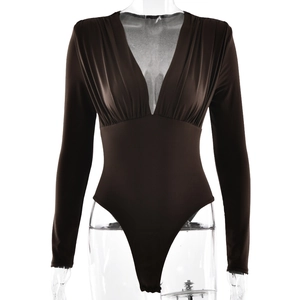 Detail of a deep V-neck ruched long sleeve bodysuit in brown with slimming fit style