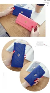 Detailed close-up of long trifold wallets featuring crown badges and quilted patterns