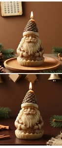 Detailed view of a lighted Santa candle with pinecone hat and textured wax beard