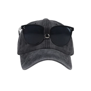 Vintage dark gray pilot baseball cap with decorative sunglasses on pure white background