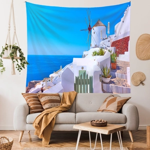 Detail of Mediterranean Santorini tapestry with white buildings and blue sea on wall