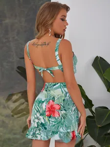 Detail of floral print crop top with back lace-up bow and ruffled mini skirt set