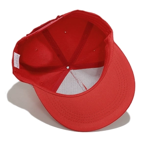 Internal detail of a red flat brim baseball cap showing the sweatband and 100% acrylic label