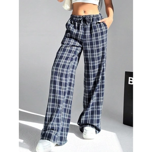 Detail shot of blue and white plaid wide-leg pants featuring elastic drawstring waistline