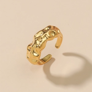 Minimalist gold plated brass open ring featuring a unique irregular lava texture finish