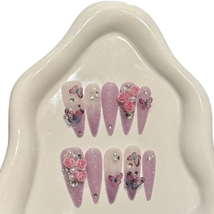 Handmade stiletto press-on nails featuring purple gradient, 3D roses and butterflies