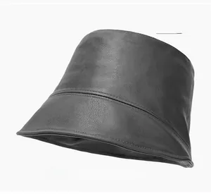 Detailed view of gray PU leather bucket hat with visible grain and stitched seams