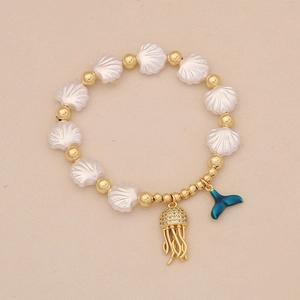 Ocean themed beaded shell bracelet with jellyfish and blue enamel fish tail charms