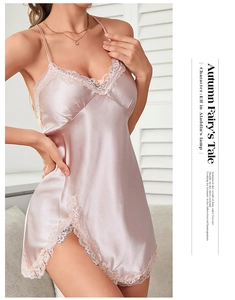 Detailed view of delicate floral lace trim on pink satin backless slip dress
