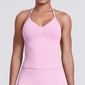 Detailed close-up of pink halter yoga bra with gathered chest design and elastic texture