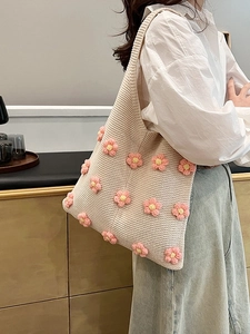 Fashionable knitted tote bag with 3D pink floral accents on beige base shoulder bag