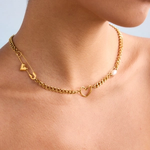 Close-up of 18K gold-plated paperclip necklace with heart and freshwater pearl charms