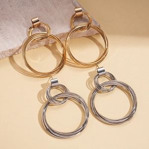 Modern gold and silver layered geometric double hoop earrings with a metallic finish