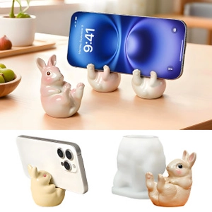 Macro view of cute rabbit-shaped phone stand and its flexible white silicone DIY mold