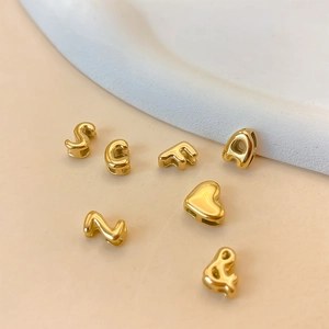 Vintage gold bubble alphabet beads and heart charms for DIY jewelry and necklaces