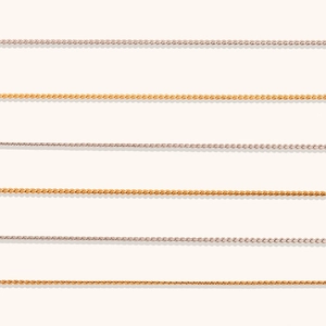 Detailed comparison of gold and rose gold stainless steel S-chains in parallel rows
