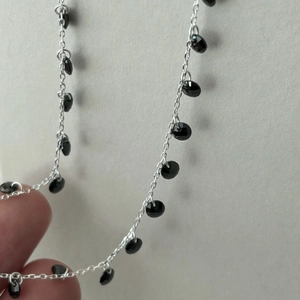 Minimalist 925 sterling silver beaded necklace with faceted black charms and fine link chain