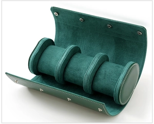 Deep green leather watch roll with three slots and velvet lining for jewelry storage