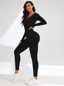 Seamless black long sleeve yoga bodysuit with open back and body-hugging slimming fit