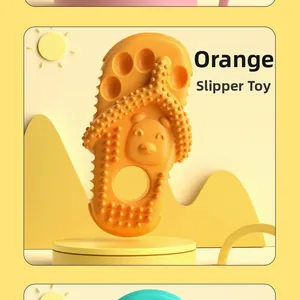 Detail of orange slipper-shaped dog chew toy with textured cleaning bumps for dental care