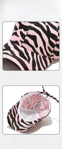 Detail view of pink zebra print cotton baseball cap with adjustable strap and breathable lining