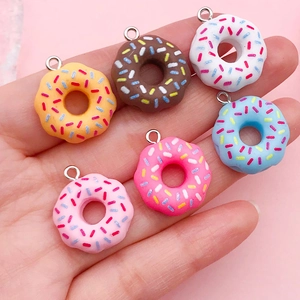 Set of colorful resin donut charms with sprinkles for DIY jewelry making and crafts