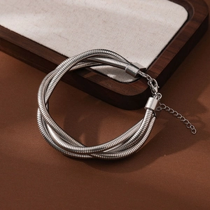 Detailed view of silver braided snake chain bracelet with adjustable lobster clasp