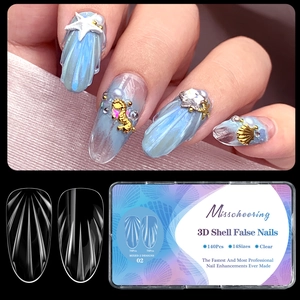 Detail of 3D shell texture almond press-on nails with starfish and pearl decorations