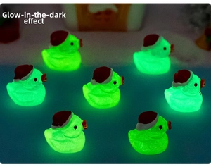 Glow in the dark miniature Christmas ducks set with luminous green effect in dark